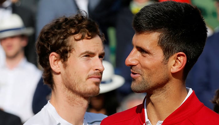 Andy Murray of Britain (L) looks on as Novak Djokovic delivers a speech after the final of French Open Mens Singles Final match in Paris, France on June 5, 2016. — Reuters