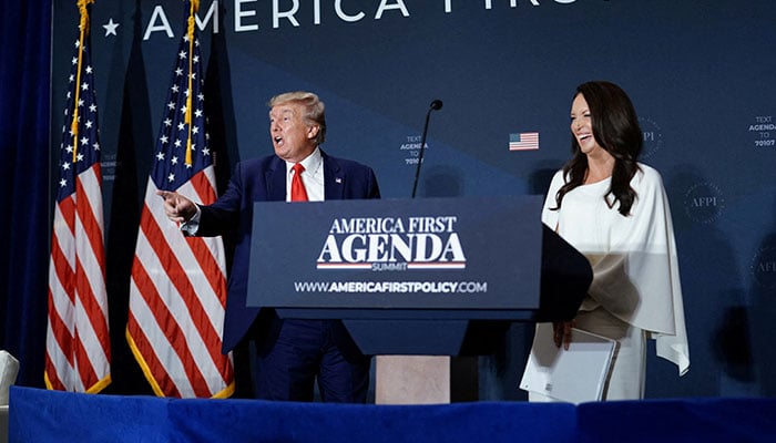 Former US President-elect Donald Trump and Brooke Rollins, President and CEO of AFPI and former Director of the US Domestic Policy Council, depart following remarks at the America First Policy Institute America First Agenda Summit in Washington, US, July 26, 2022. — Reuters