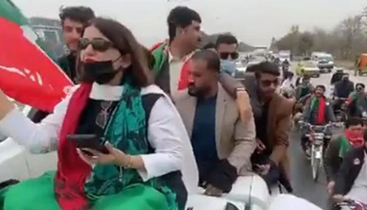 PTIs Seemabia Tahir is seen sitting on top of a vehicle as she leads a protest rally in Rawalpindi on March 10, 2024. — Screengrab/X/@balochi5252