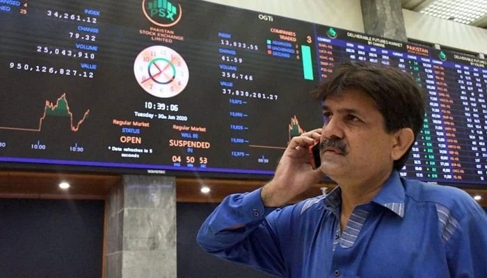 A broker talks on the phone at the Pakistan Stock Exchange in Karachi on May 20, 2024. — PPI