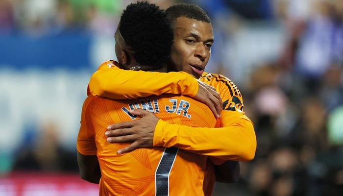 Real Madrids Kylian Mbappe celebrates scoring his first goal for his club with Vinicius Junior during La Liga match against Leganes at Estadio Municipal de Butarque, Leganes, Spain on November 24, 2024. — Reuters