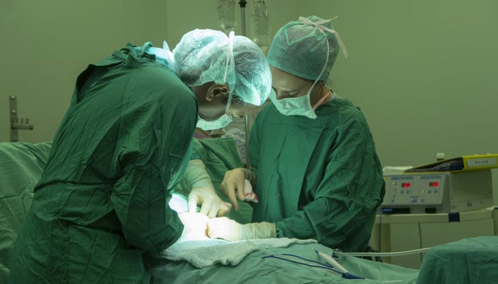 A representational image depicting doctors performing a surgery in a hospitals operation room. — Unsplash/File