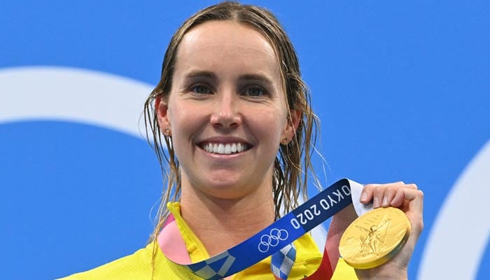 An undated image shows Australian gold medallist Emma McKeon with her medal on the podium after the final of the womens 50m freestyle swimming event during the Tokyo 2020 Olympic Games at the Tokyo Aquatics Centre in Tokyo. — AFP