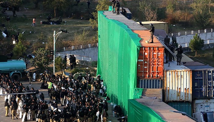 A view of large number of police personal stand near container at D-Chowk due to PTI protest in twin cites on November 25, 2024. — INP