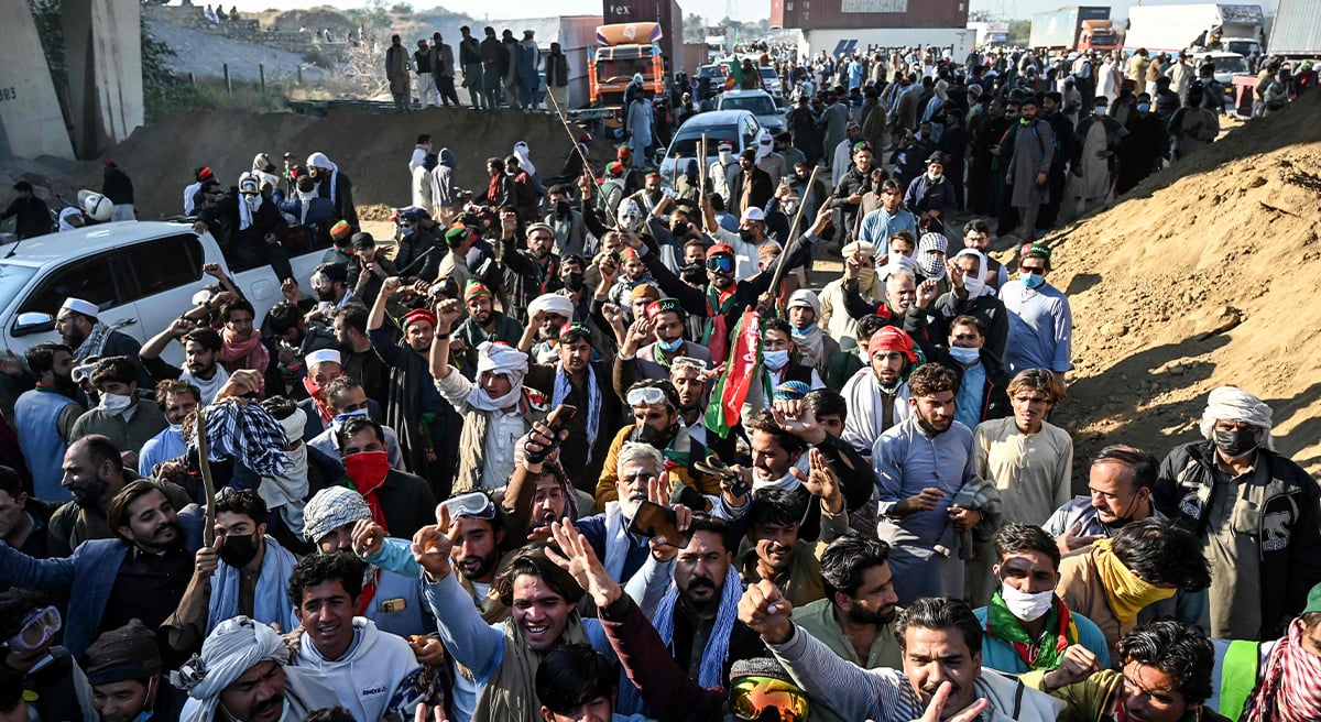 Supporters of jailed former prime minister Imran Khan´s PTI shout slogans as they march towards Islamabad after clearing containers in Hasan Abdal in Punjab province on November 25, 2024. — AFP