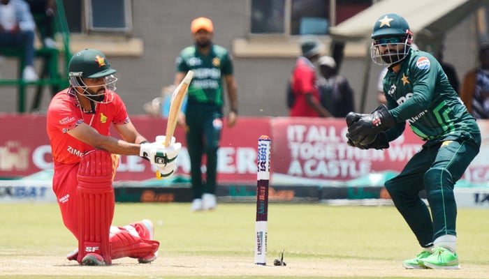 Zimbabwe´s Sikandar Raza (L) plays a sweep during the 1st ODI between Zimbabwe and Pakistan at Queens Sports Club in Bulawayo, on November 24, 2024. — AFP