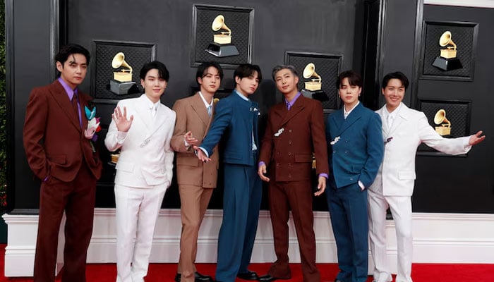 BTS pose on the red carpet as they attend the 64th Annual Grammy Awards at the MGM Grand Garden Arena in Las Vegas, Nevada, U.S., April 3, 2022.