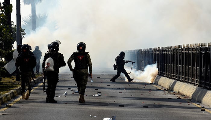 Security force personnel fire tear gas shells to disperse the PTI supporters during a protest to demand the release of Khan, in Islamabad, Pakistan, November 26, 2024. — Reuters