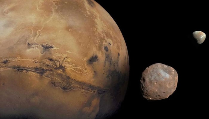 Image shows Mars and its moons Phobos and Deimos. — Nasa/File