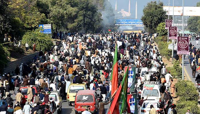 Supporters of the former Pakistani prime minister Imran Khans party, Pakistan Tehreek-e-Insaf (PTI), attend a protest demanding the release of Khan, Islamabad, November 26, 2024. — Reuters