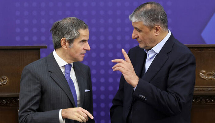 Irans head of the Atomic Energy Organisation Mohammad Eslami (R), speaks to the United Nations nuclear chief Rafael Grossi, following a joint press conference in Tehran on November 14, 2024. — AFP