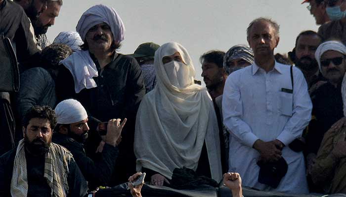 PTI founder Imran Khans wife Bushra Bibi (centre) pictured along KP CM Ali Amin Gandapur (left) and NA Opposition Leader Omar Ayub during the partys protest in Islamabad on November 26, 2024. — Reuters