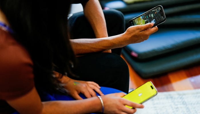 A representational image of school children using phones. — Reuters