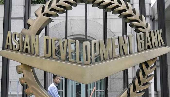 A worker walks past inside the Asian Development Bank (ADB) headquarters in this file photo. — Reuters