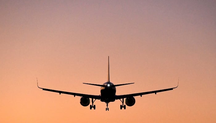 A passenger aircraft descends to land, January 5, 2022. — Reuters