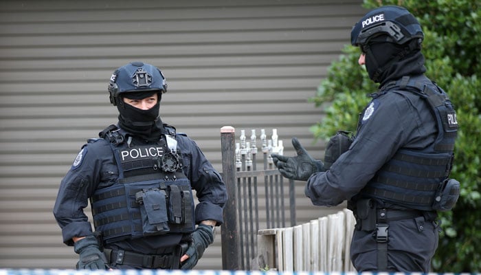 The image shows policemen in Australia. — Reuters/File