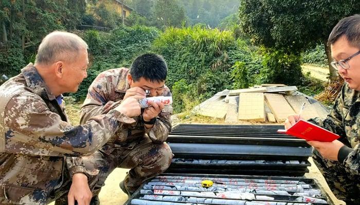 Mining experts pictured while working on the site of the newly discovered gold reservoir in Pingjiang, Hunan province, China. — Xinhua/file