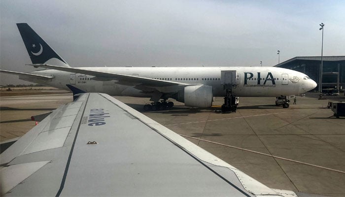 This file photo shows a Pakistan International Airlines plane at an airport. — Reuters