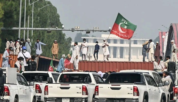 PTI supporters and activists pictured at a roadblock during a protest in Islamabad on October 5, 2024. — AFP