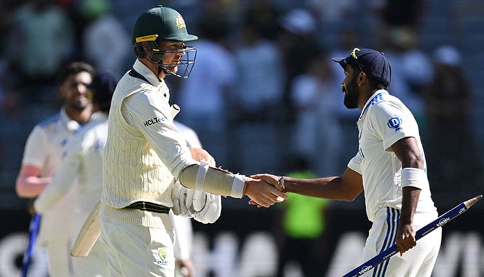 Australias Josh Hazlewood shakes hands with Indias Jasprit Bumrah after the match on November 25, 2024. — Reuters