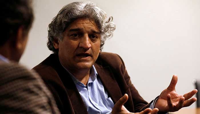 Senior journalist Matiullah Jan gestures during an interview at his office in Islamabad. — Reuters/File