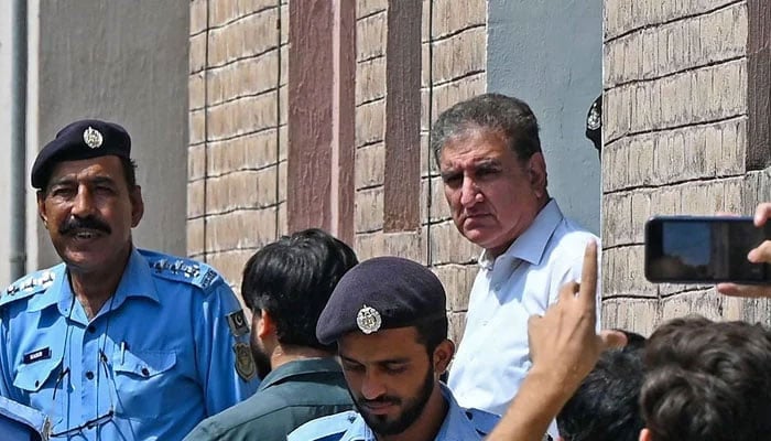 PTI senior leader Shah Mahmood Qureshi is seen outside a special court after he was granted a four-day physical remand in Islamabad on August 21, 2023. — AFP