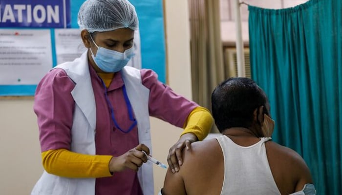 A representational image of a man getting vaccinated against COVID-19 at a vaccination centre, in New Delhi, India on February 13, 2021. — Reuters