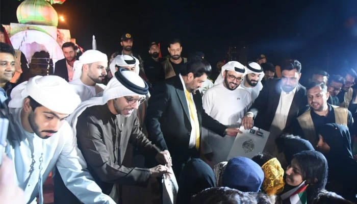 UAE Ambassador to Pakistan Hamad Obaid Ibrahim, Consul General Bakheet Ateeq and Governor Sindh Kamran Tessori distribute gifts on UAEs 53rd National Day.— FB/Governor Sindh