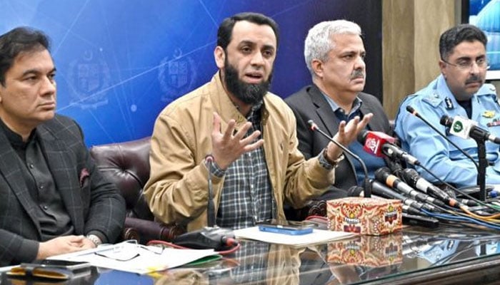 Information Minister Attaullah Tarar (second from left) addresses a press conference on December 1, 2024. — APP