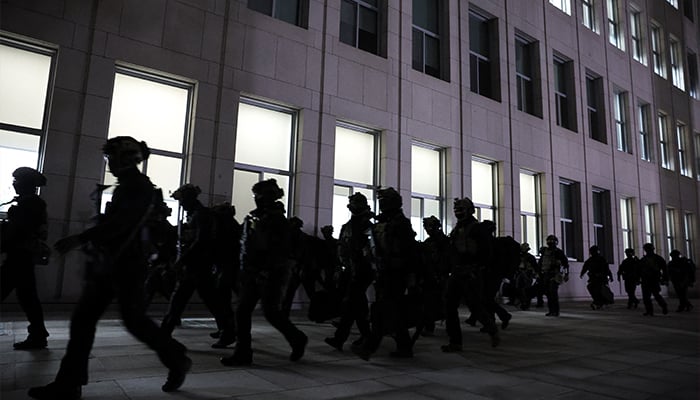 Military forces move outside the National Assembly, after South Korean President Yoon Suk Yeol declared martial law, in Seoul, South Korea, December 4, 2024. — Reuters