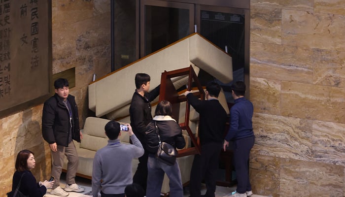 South Koreas main opposition Democratic Partys staff set up a barricade to block soldiers at the National Assembly after South Korean President Yoon Suk Yeol declared martial law in Seoul, South Korea, December 3, 2024. — Reuters