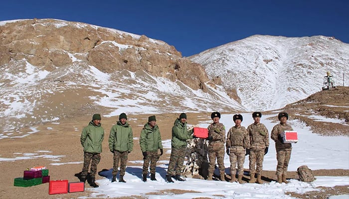 Indian and Chinese army greet each other along the Line of Actual Control (LAC) near Karakoram pass in Ladakh. — AFP/File