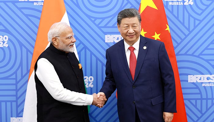 Chinese President Xi Jinping and India Prime Minister Narendra Modi meet on the sidelines of the BRICS summit in Kazan, Russia October 23, 2024. — Reuters