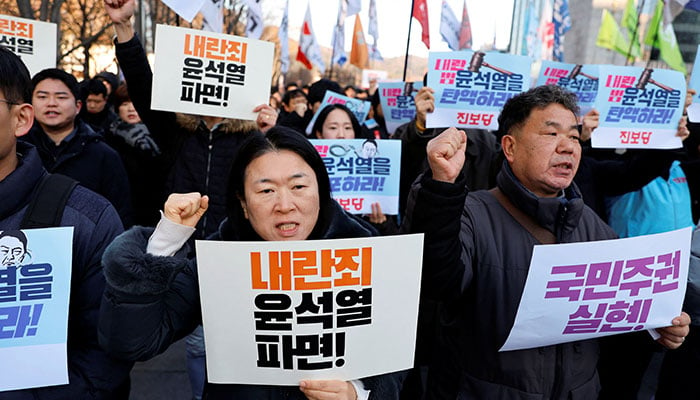 People take part in a rally to demand South Korean President Yoon Suk Yeols removal from power, in Seoul, South Korea, December 4, 2024. — Reuters