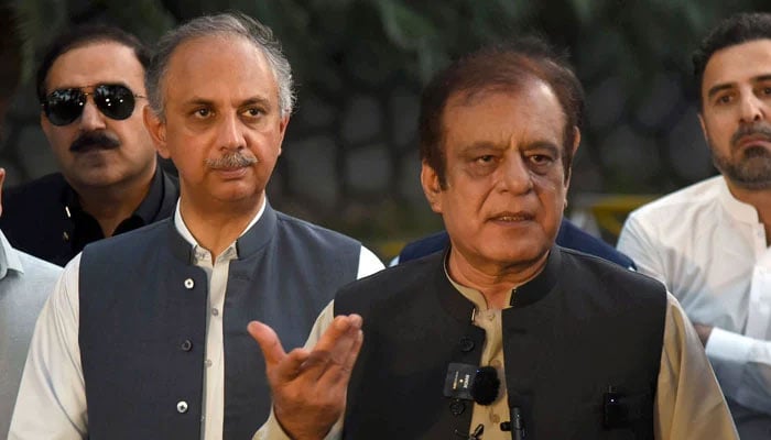 Leader of Opposition in National Assembly Omar Ayub and Leader of Opposition in Senate Syed Shibli Faraz talk to media persons at Khyber Pakhtunkhwa House in the Islamabad on May 6, 2024. — Online