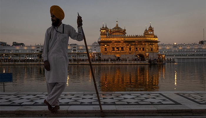 A Sikh volunteer stands guard inside the holy Sikh shrine of the Golden Temple in Amritsar, in the northern state of Punjab, India, September 20, 2023. — Reuters