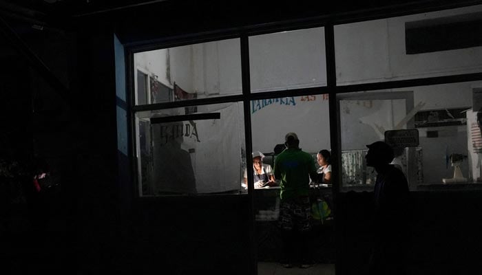 A client buys bread inside a bakery during a blackout in Havana, Cuba, November 20, 2024. — Reuters