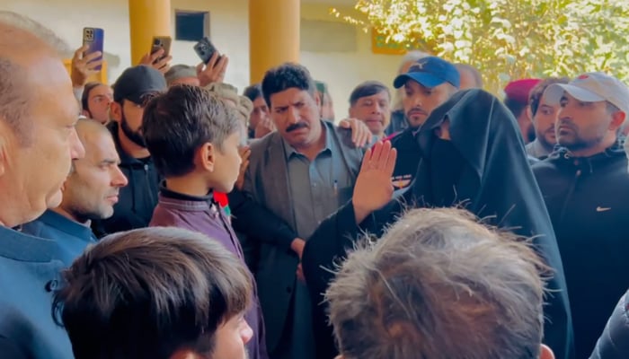 Pakistan Tehreek-e-Insaf founder Imran Khans wife Bushra Bibi speaks to PTI supporters in Charsadda, on December 6, 2024. — Screengrab/Reporter