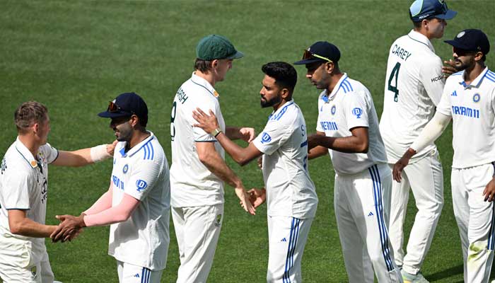 Indian and Australian players come together after the match on the third day of the second Test at the Adelaide Oval in Adelaide on December 8, 2024. — AFP