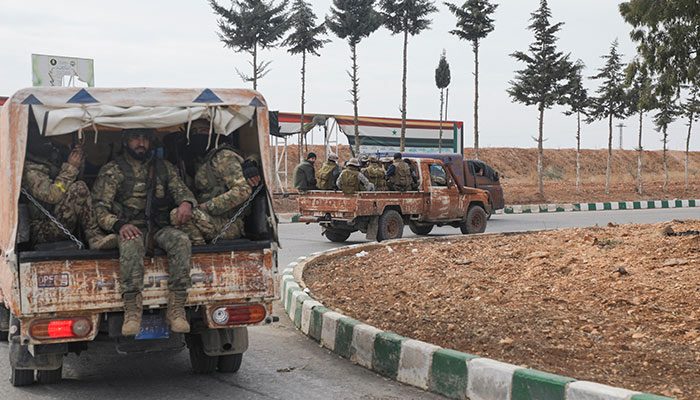 Rebel fighters sit on a vehicle in Homs countryside, after Syrian rebels pressed their lightning advance on Saturday, saying they had seized most of the south, as government forces dug in to defend the key central city of Homs to try to save President Bashar al-Assads 24-year rule, in Syria December 7, 2024. — Reuters