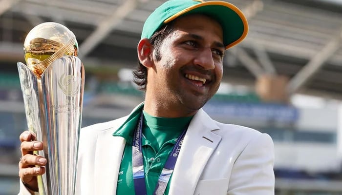 Former Pakistan skipper Sarfaraz Ahmed poses with the Champions Trophy in 2017. — AFP