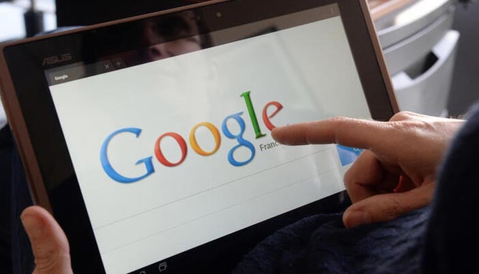 The picture shows a person using Google on a tab. — AFP/File