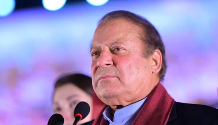 Nawaz Sharif looks at his supporters gathered at Minar-e-Pakistan during an event held to welcome him in Lahore on October 21, 2023. — X/@pmln_org