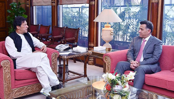 Then prime minister Imran Khan (left) in conversation with then DG ISI Faiz Hameed at the PM Office in Islamabad. — PM Office/File