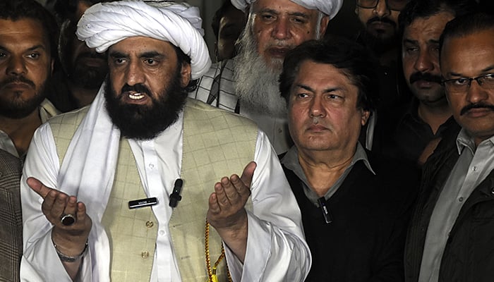 JUI-F leader Hafiz Hamdullah (left) addressing a press conference along side PTI leader Barrister Saif (right) at his residence in Islamabad on February 15, 2024. — Online