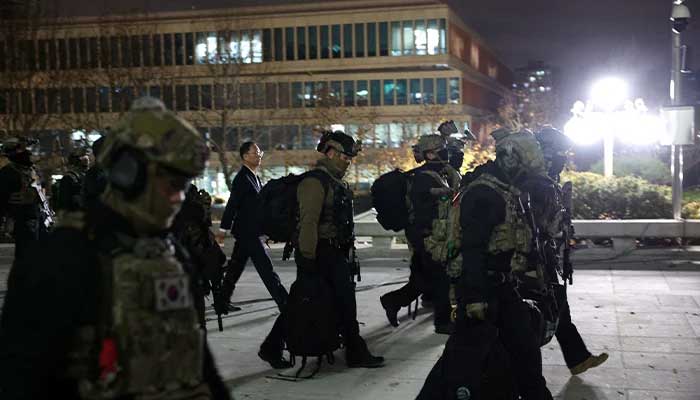 South Korean troops walk outside the National Assembly after President Yoon Suk Yeol declared martial law, in Seoul, South Korea on December 4, 2024. — Reuters