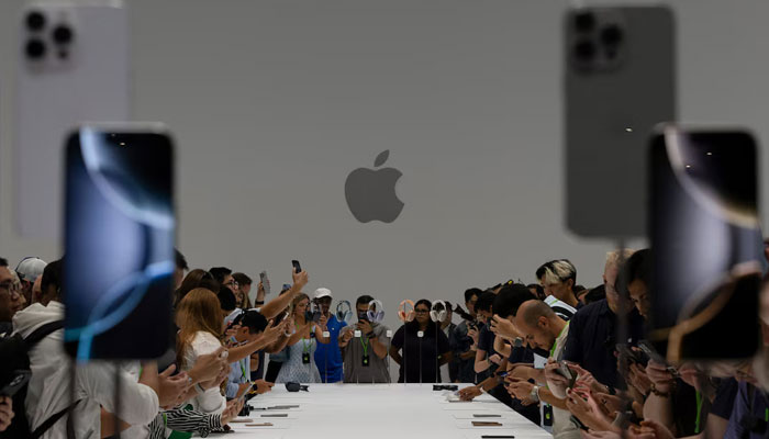 Attendees test the iPhone 16 Pro as Apple holds an event at the Steve Jobs Theater on its campus in Cupertino, California, US September 9, 2024. — Reuters