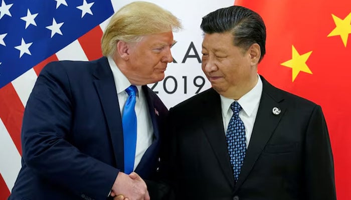 US President-elect Donald Trump meets pictured while shaking hands with Chinas President Xi Jinping at the start of their bilateral meeting at the G20 leaders summit in Osaka, Japan, June 29, 2019. — Reuters