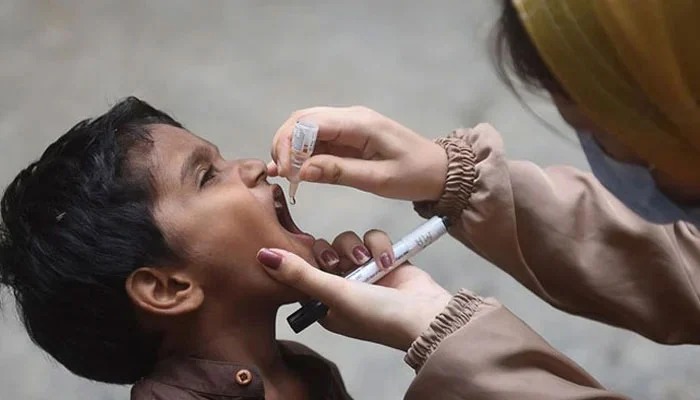 Representational image shows a health worker administering polio drops to a child during a vaccination campaign on August 7, 2023. — AFP