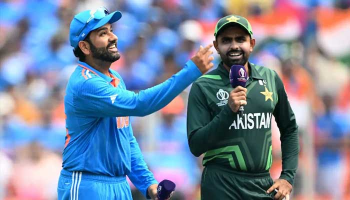 Indian captain Rohit Sharma (Left) and Pakistan Babar Azam during the toss in this undated image. — AFP